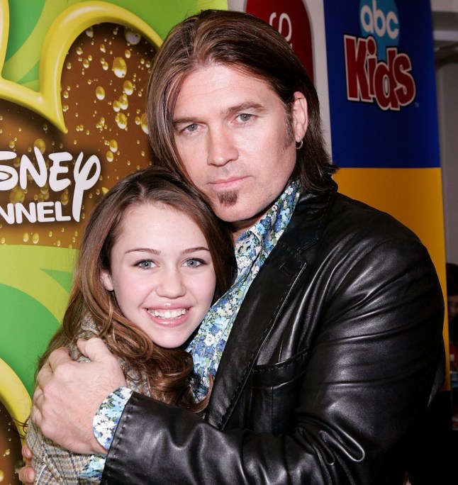 Disney Channel actors Miley Cyrus and her father Billy Ray Cyrus poses as Stars of the Disney Channel appear at Splashlight Studios February 9, 2006 in New York City. (Photo by Paul Hawthorne/Getty Images) *** Local Caption *** Miley Cyrus;Billy Ray Cyrus....* SPECIAL INSTRUCTIONS: * *OBJECT NAME: 56785266PH006_Disney_Channe*