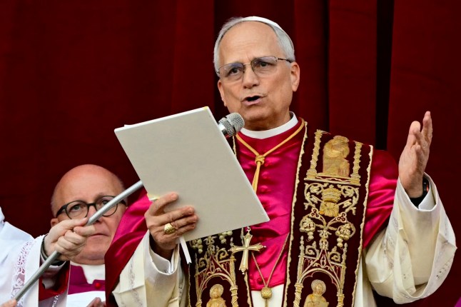 Newly elected Pope Leo XIV, Robert Prevost addresses the crowd on the main central loggia balcony of the St Peter's Basilica.