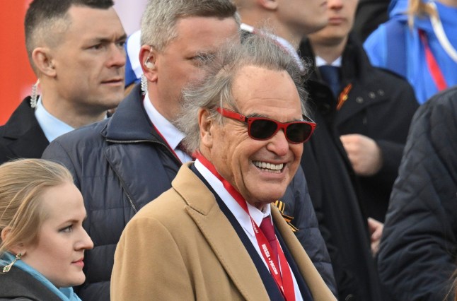US director Oliver Stone smiles as he watches the Victory Day military parade in Moscow, Russia, Friday, May 9, 2025, during celebrations of the 80th anniversary of the Soviet Union's victory over Nazi Germany during the World War II. (Ilya Pitalev/Photo host agency RIA Novosti via AP)