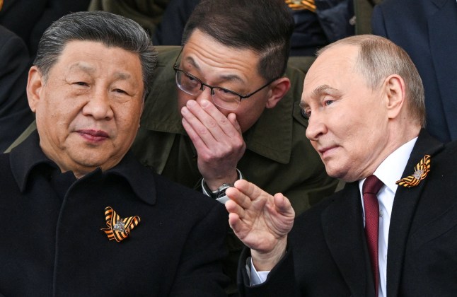 Russian President Vladimir Putin and his Chinese counterpart Xi Jinping attend a military parade on Victory Day, marking the 80th anniversary of the victory over Nazi Germany in World War Two, in Red Square in central Moscow, Russia, May 9, 2025. Sergei Bobylyov/Host agency RIA Novosti/Handout via REUTERS ATTENTION EDITORS - THIS IMAGE WAS PROVIDED BY A THIRD PARTY.