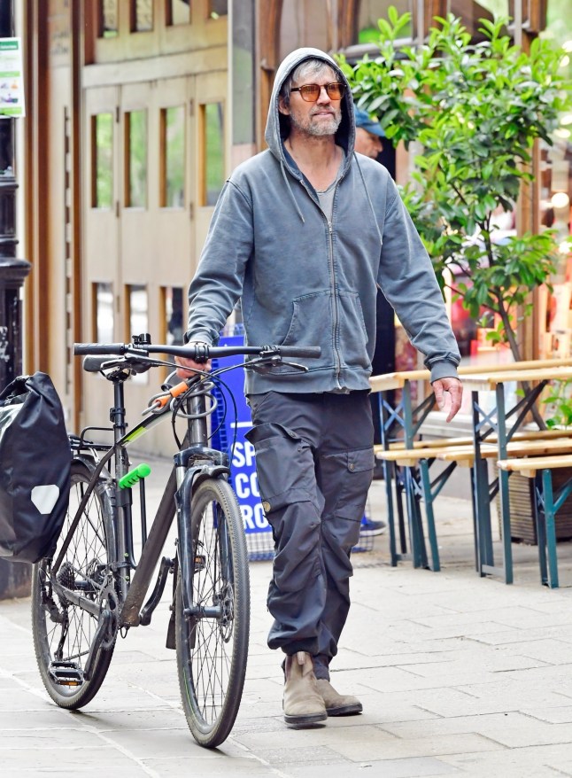 BGUK_3232999 - London, UNITED KINGDOM - *EXCLUSIVE* - Take That star Jason Orange, 54, looks nearly unrecognisable during a casual outing in Primrose Hill. The ???90s pop icon kept a low profile in sunglasses and a grey hoodie as he cycled through London, making a stop at the natural pharmacy 'House of Mistry.' Pictured: Jason Orange BACKGRID UK 8 MAY 2025 BYLINE MUST READ: BACKGRID UK: +44 208 344 2007 / uksales@backgrid.com USA: +1 310 798 9111 / usasales@backgrid.com *Pictures Containing Children Please Pixelate Face Prior To Publication*